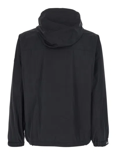Tatras Black Jacket With Drawstring Hood And Logo Patch On The Sleeve In Tech Fabric Man In Black