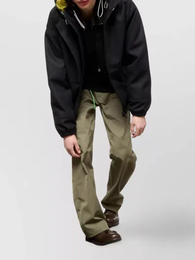 Gr10k Hooded Black Logo Jacket With Contrasting Lining And Adjustable Features In Black