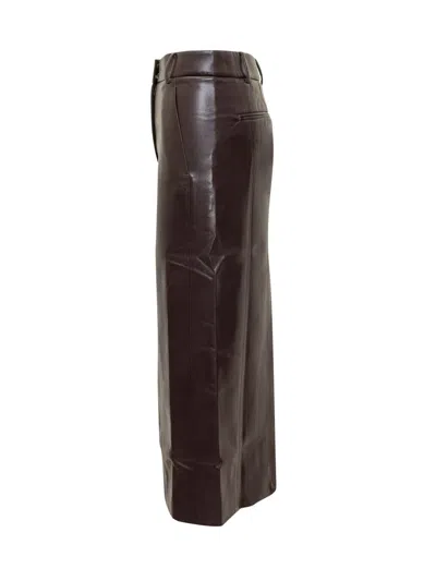 The Andamane Bordeaux Faux Leather Midi Skirt In Burgundy
