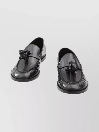 The Row Flat Sole Leather Loafers Featuring Tassel Detail In Black