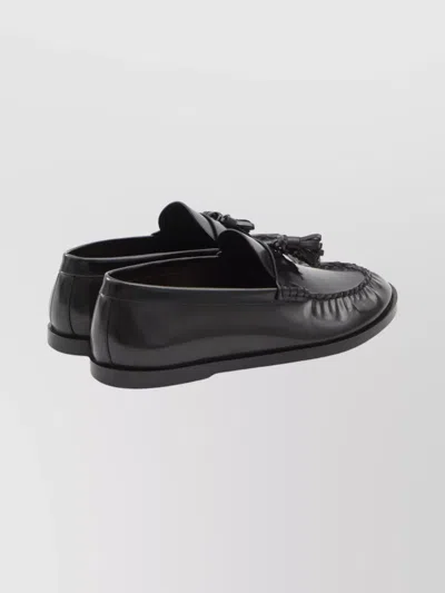The Row Flat Sole Leather Loafers Featuring Tassel Detail In Black
