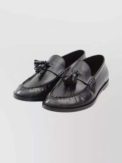 The Row Flat Sole Leather Loafers Featuring Tassel Detail In Black