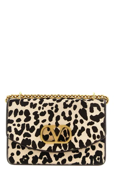 Valentino Garavani Vain Small Cow-print Leather And Calf-hair Shoulder Bag In Multi