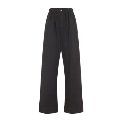 Carven Wide-leg Wool Trousers With Elastic Waistband And Buttoned Details In Black