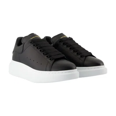 Alexander Mcqueen Black Low Top Sneakers With Logo Lettering On Tongue And Heel In Leather Woman In Black