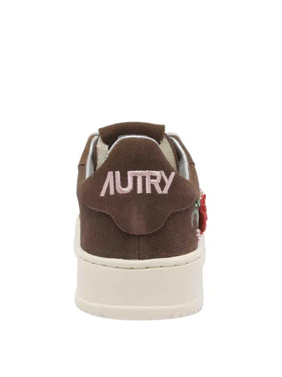 Autry Low-top Sneakers With Floral Embroidery In Rich Brown In Brown