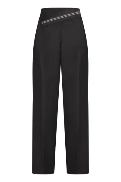 Fendi Wool Carrot-fit Trousers In Black