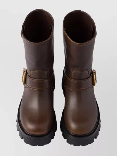 Prada Triangle Logo Distressed Leather Ankle Boots In Brown