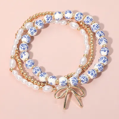 Fashnzfab 3pcs - Metal Bow Charm Pointed Ceramic Ball Pearl Beaded Stretch Multi Layered Bracelets In Gold