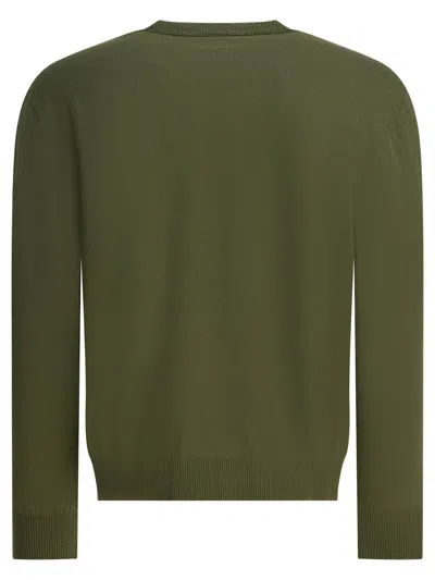 C.p. Company Crew Neck Knitwear With Ribbed Cuffs And Pocket In Green