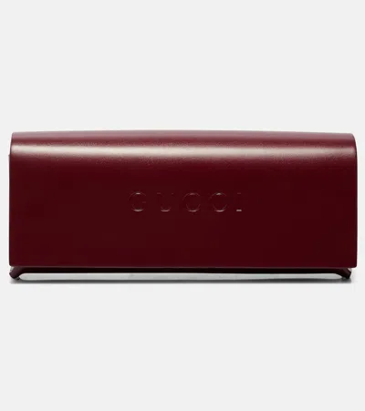 Gucci Gg Tiny Oval Sunglasses In Orange