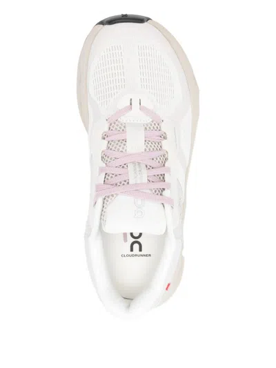 On Running Perforated Trainers In White