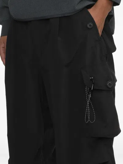 And Wander Multiple-pocket Cargo Pants In Black