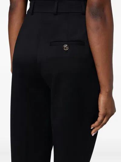 Moschino Pleated Trousers In Black