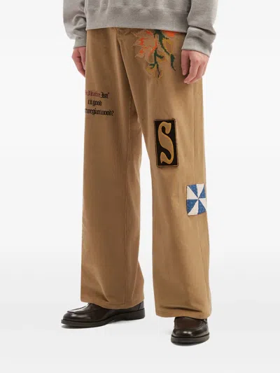 Khoki Floral-embroidery Patch-detail Trousers In Brown