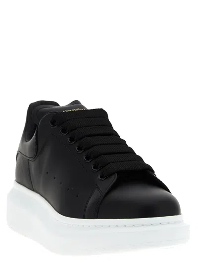 Alexander Mcqueen Black Low Top Sneakers With Logo Lettering On Tongue And Heel In Leather Woman In Black