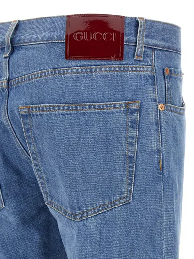 Gucci Blue Jeans With Logo Patch On The Rear And Web Turn-up Hem In Denim Man In Blue