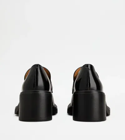 Tod's Block Heel Round Toe Loafers With Hardware In Black