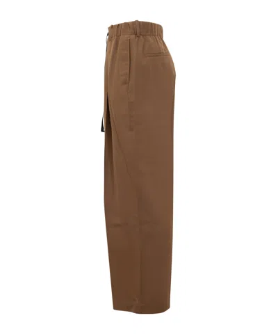 Studio Nicholson Elasticated-drawcord Trousers In Brown