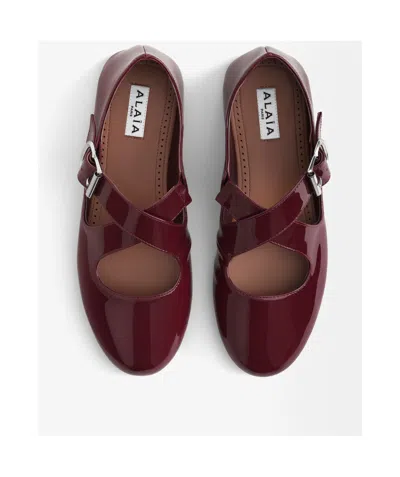 Alaïa Patent Leather Criss-cross Ballet Flats In Burgundy