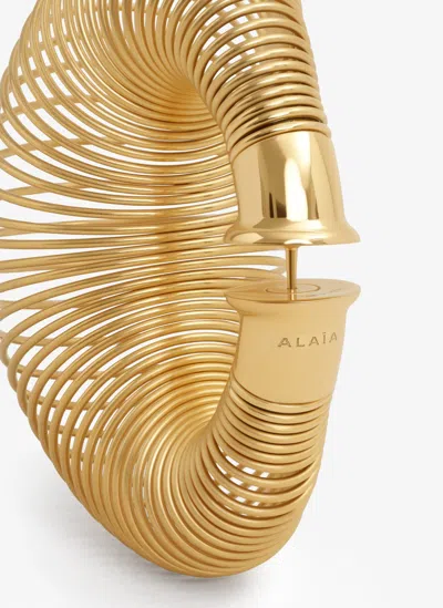 Alaïa Spiral Small Hoop Earrings In Gold