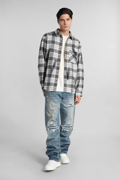 Amiri Men Blue Jeans With Ripped Details On The Front And Logo Patch On The Rear In Denim Man In Blue