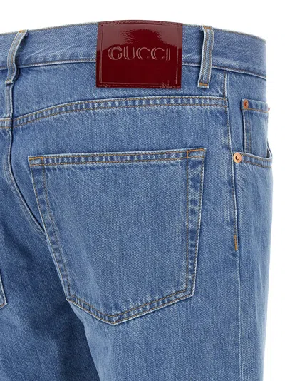 Gucci Blue Jeans With Logo Patch On The Rear And Web Turn-up Hem In Denim Man In Blue