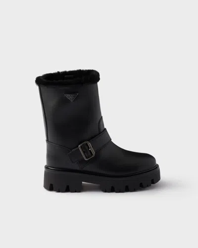 Prada Stiefeletten Aus Leder Und Lammfell In Black