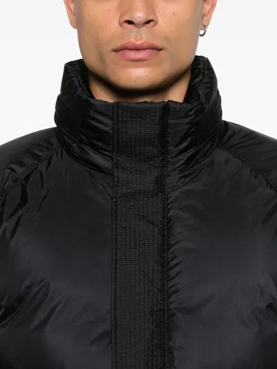 C.p. Company Quilted Panelled Jacket In Black