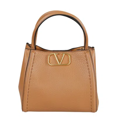 Valentino Grainy Calfskin Handbag In Brown