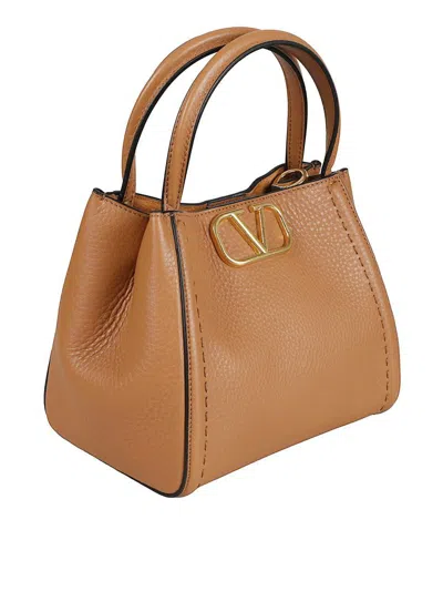 Valentino Grainy Calfskin Handbag In Brown
