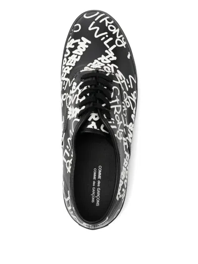 Comme Des Garçons Message Printed Leather Vulcanized Sneakers In Black