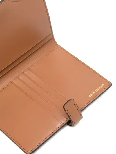 Michael Kors Jet Set Signature Logo Passport Wallet In Brown