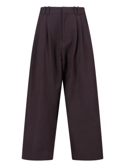 Studio Nicholson Straight-leg Trousers With Tailored Silhouette And Minimalist Aesthetic In Brown