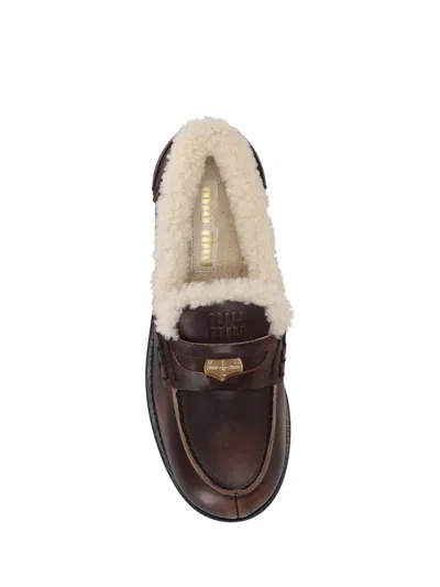 Miu Miu Bleached Leather And Shearling Penny Loafers In Brown