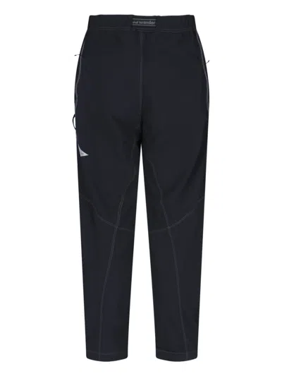And Wander Streamlined Black Trousers With Zippered Pockets In Blue