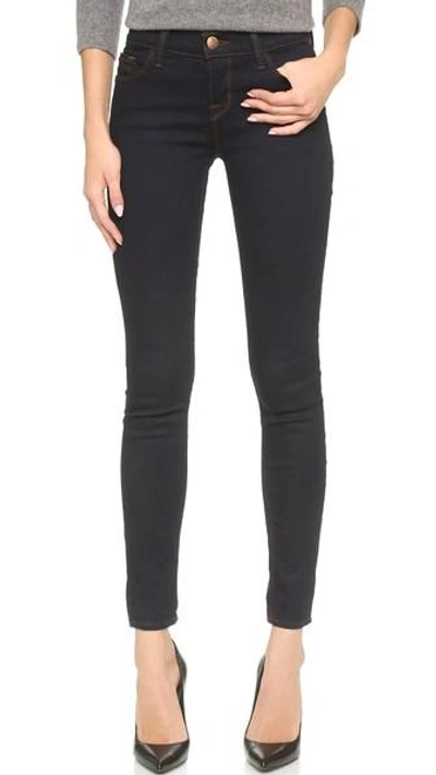 Shop J Brand 811 Mid Rise Skinny Jeans In Ink