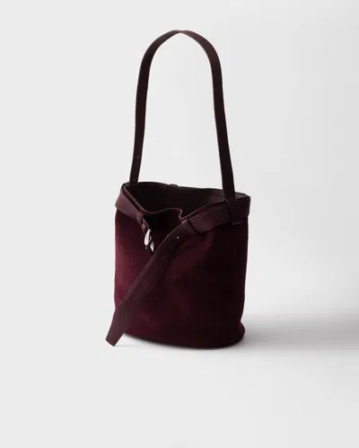 Prada Buckle Belted Suede Bucket Bag In Burgundy