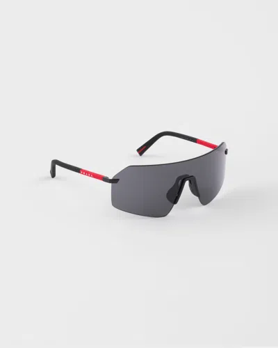 Prada Linea Rossa Metal-frame Sunglasses In Gray