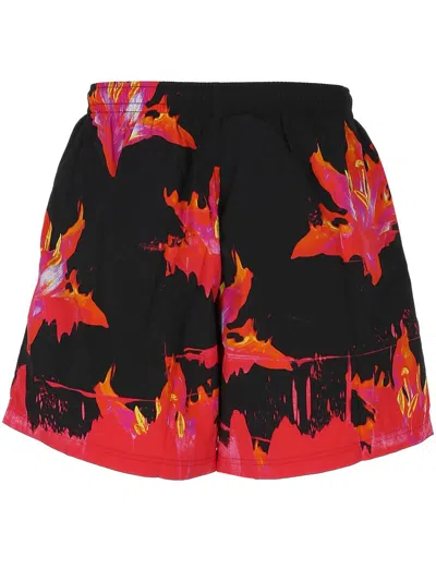 Alexander Mcqueen Lily Print Swim Shorts In Black