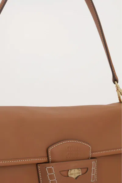 Miu Miu Leather Penny Shoulder Bag With Adjustable Strap In Brown