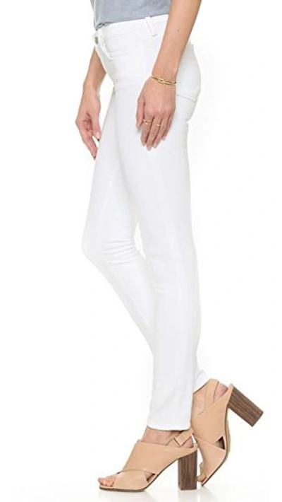 Shop J Brand 811 Mid Rise Skinny Jeans In Blanc