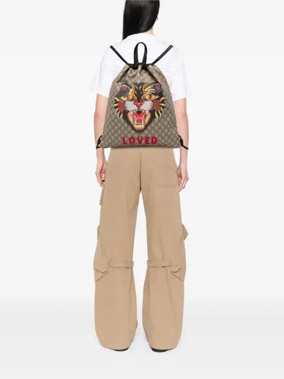 Pre-owned Gucci 2016-2025 Gg Supreme Angry Cat Drawstring Backpack In Brown