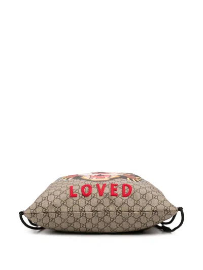 Pre-owned Gucci 2016-2025 Gg Supreme Angry Cat Drawstring Backpack In Brown