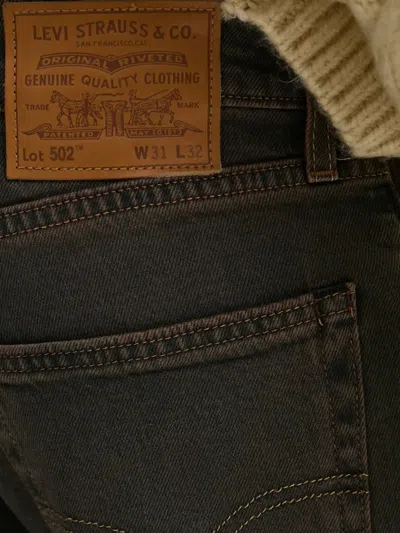 Levi's 502 Logo-patch Jeans In Brown
