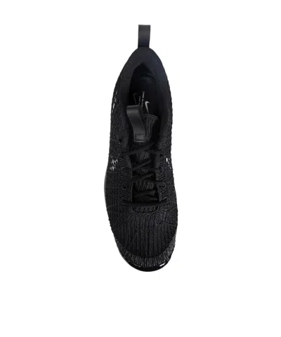 Comme Des Garçons Textured Black Sneakers With Low-profile Design And Distinctive Branding In Black