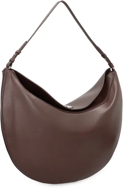 Jacquemus Le Calisso Rond Large Brown Shoulder Bag With Adjustable Strap And Embossed Logo In Leather Woman In Brown