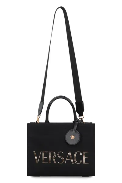 Versace Studded Logo Canvas Tote Bag In Black