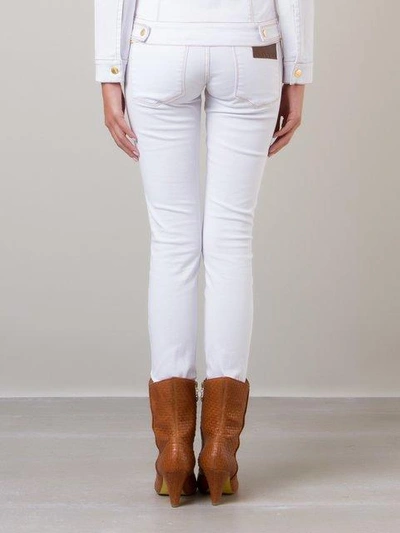 Shop Amapô Skinny Trousers In White