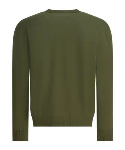 C.p. Company Crew Neck Knitwear With Ribbed Cuffs And Pocket In Green